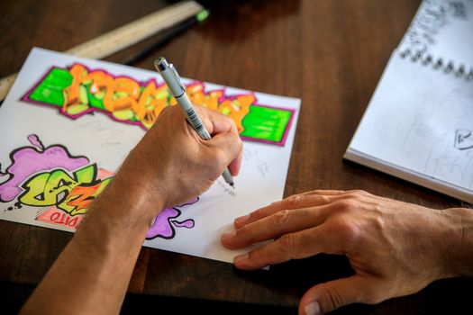 Man Drawing on Paper
