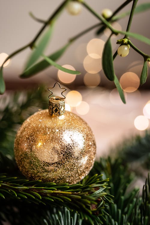 Close-Up Photo of a Gold Christmas Ball