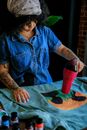 Woman Drying Painted Fabric