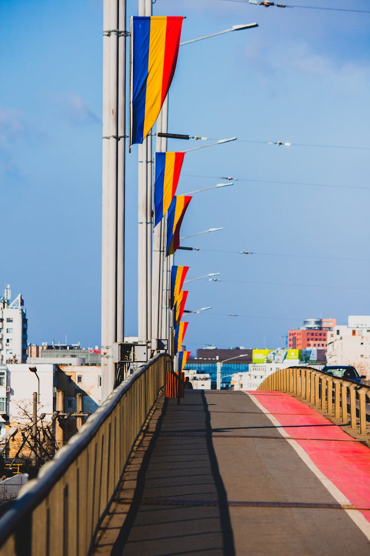 A Bridge Lined With Romanian Flags