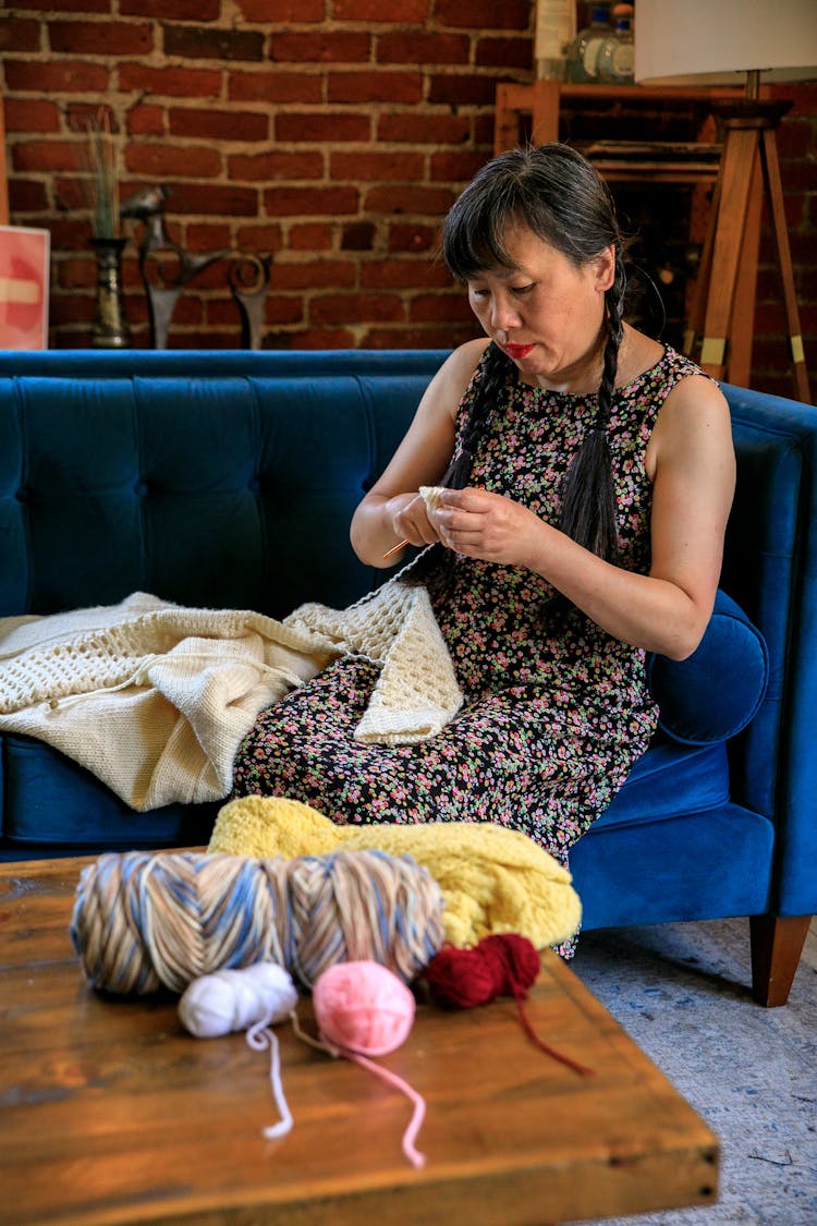 Woman In Dress Crocheting