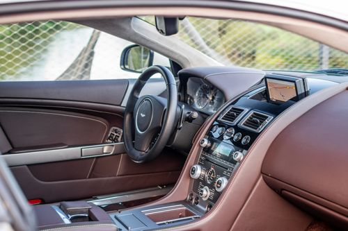 Free Explore the elegant and modern interior of a luxury sports car featuring leather seats and advanced dashboard controls. Stock Photo
