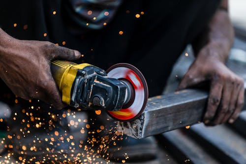 Free Person Grinding the Metal  Stock Photo