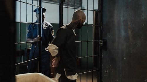 Prisoner Walking into Cell
