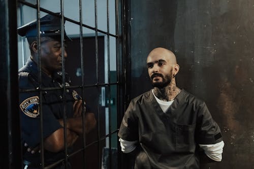 Policeman Near a Prisoner in Jail