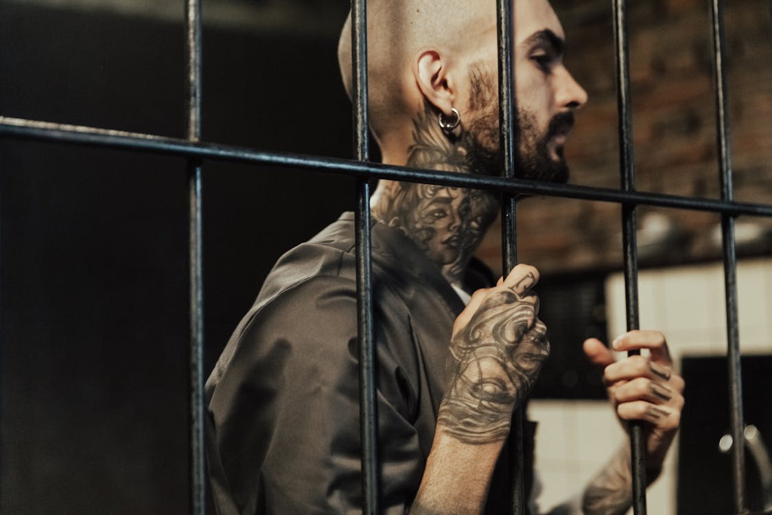 Tattooed man Inside a Prison 