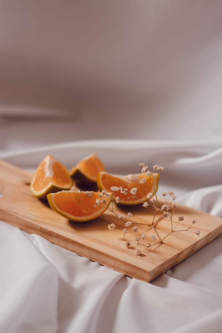 Orange Wedges On Wooden Tray