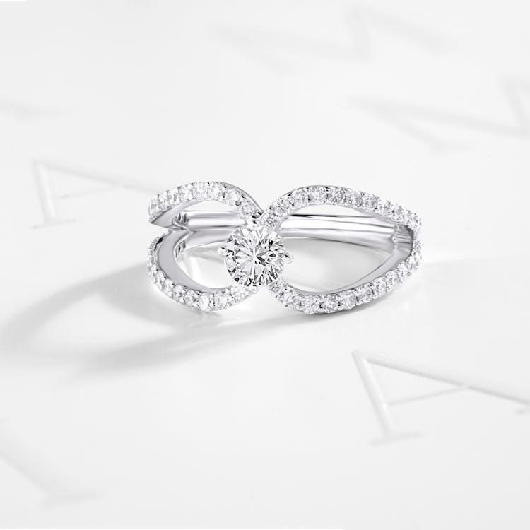 Free Diamond Ring on White Surface Stock Photo
