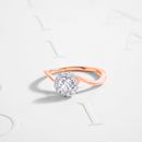Silver Diamond Ring on White Surface