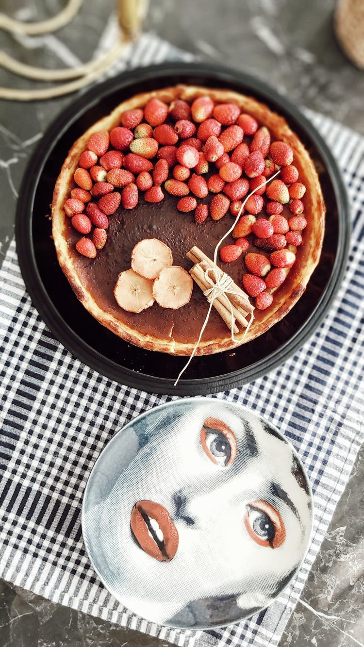 Cake With Fruit And Woman Face In Mirror