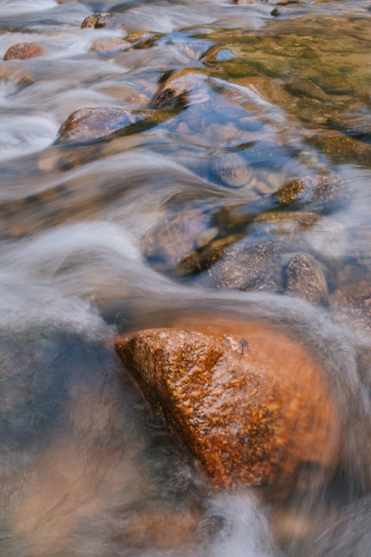 Water Flowing Over Rocks In The River