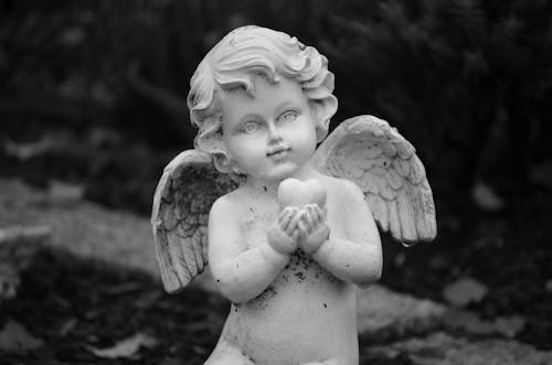 Angel Statue in Grayscale Photography