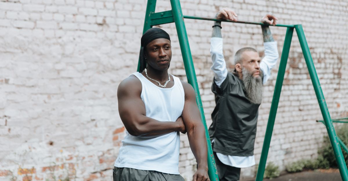 Bodybuilde Inmate Muscular Build of Prisoner Standing in Jail Yard · Free Stock Photo