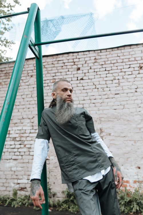 Bearded Inmate Bearded Inmate Standing near a Brick Wall · Free Stock Photo
