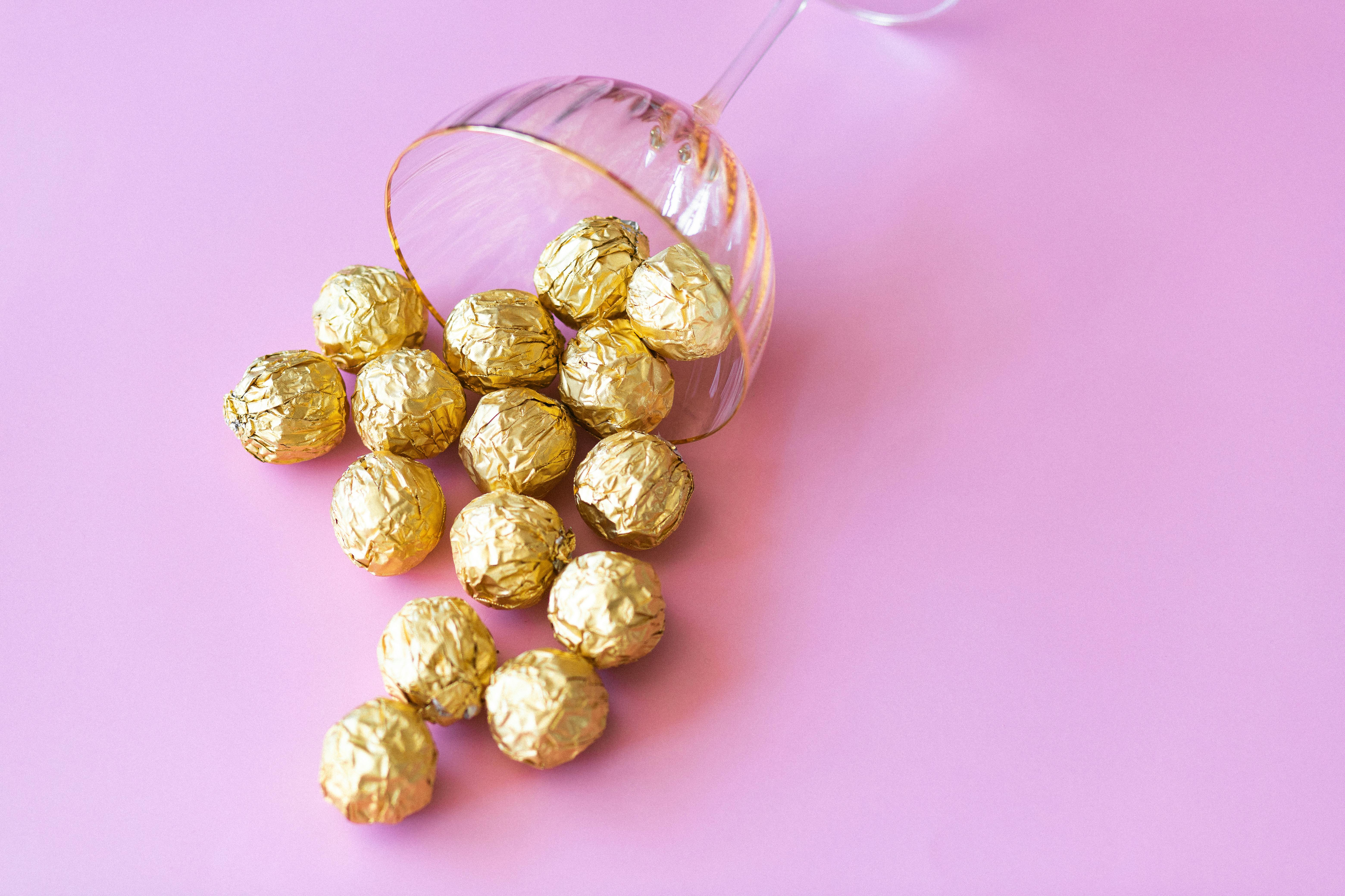 Chocolate Balls Wrapped in Gold Foil · Free Stock Photo