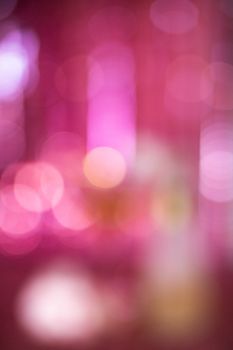 Abstract pink bokeh with blurred lights creating a vibrant, dreamy background.