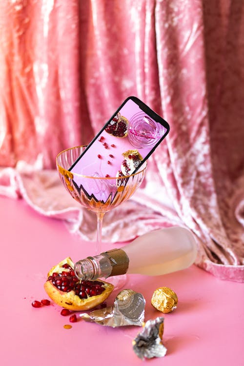 Smartphone in Clear Champagne Glass