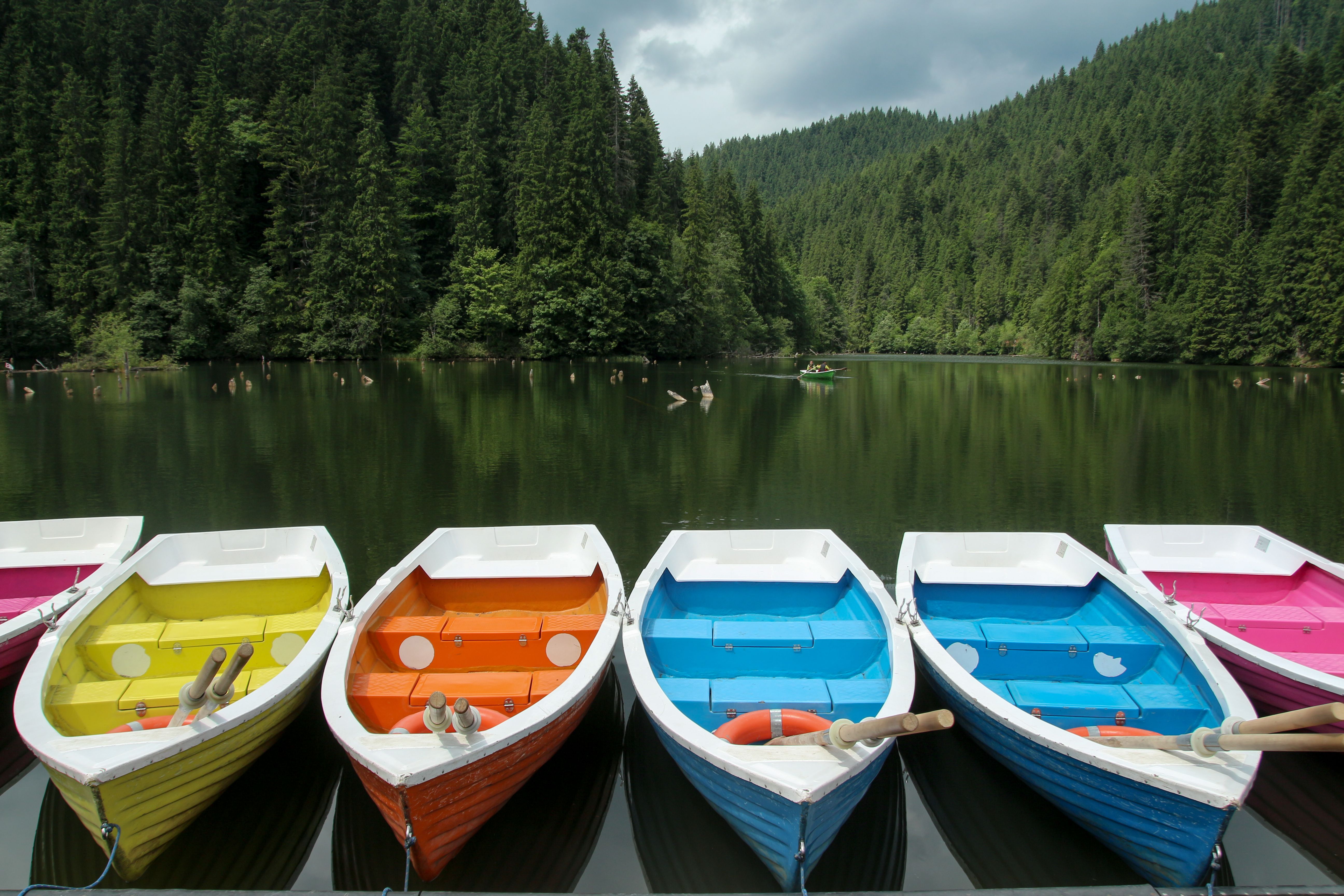 Empty Colorful Boats on Body of Water · Free Stock Photo