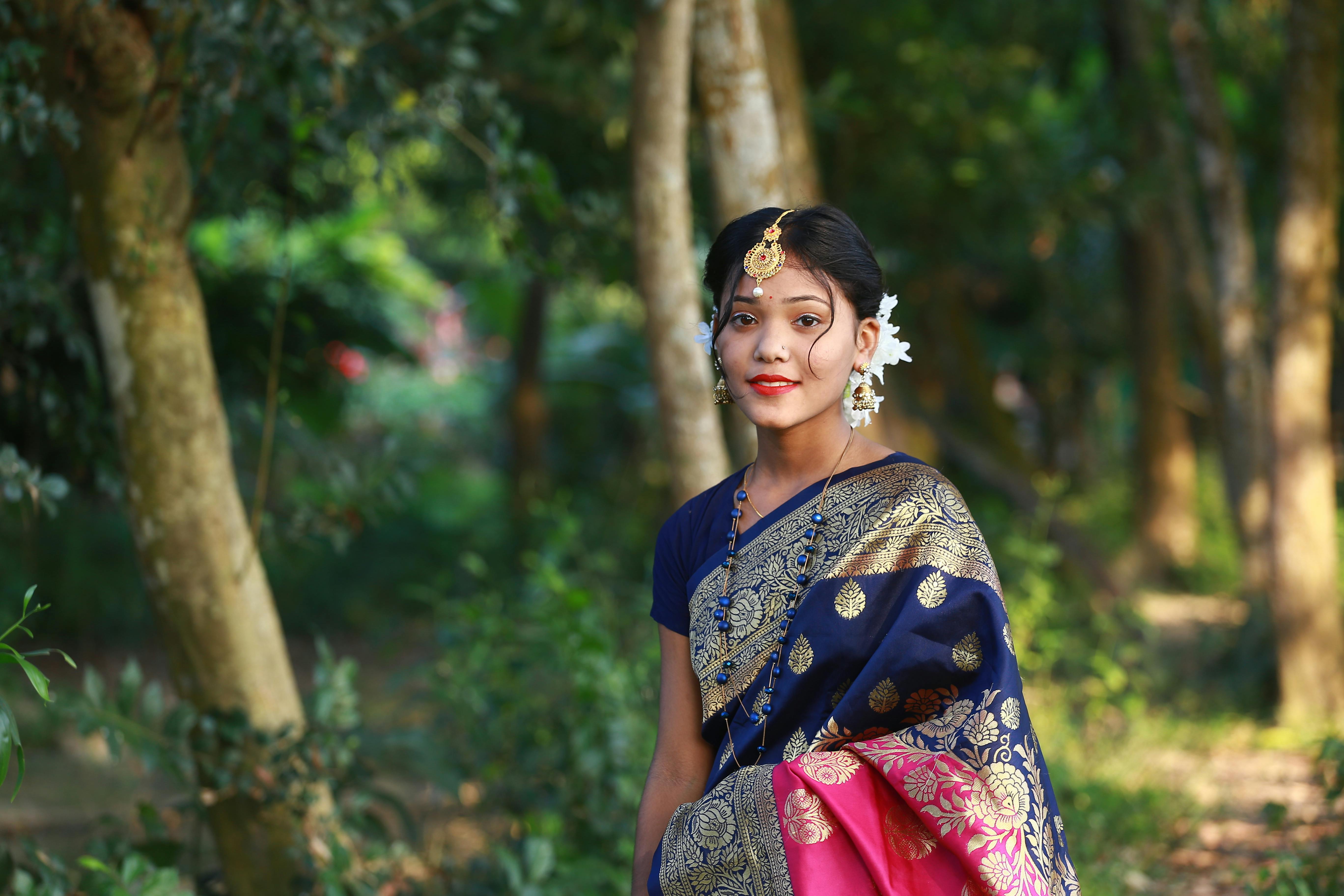 Image of Indian traditional Beautiful Woman Wearing an traditional Saree  And Posing On The Outdoor With a Smile Face-HI450307-Picxy