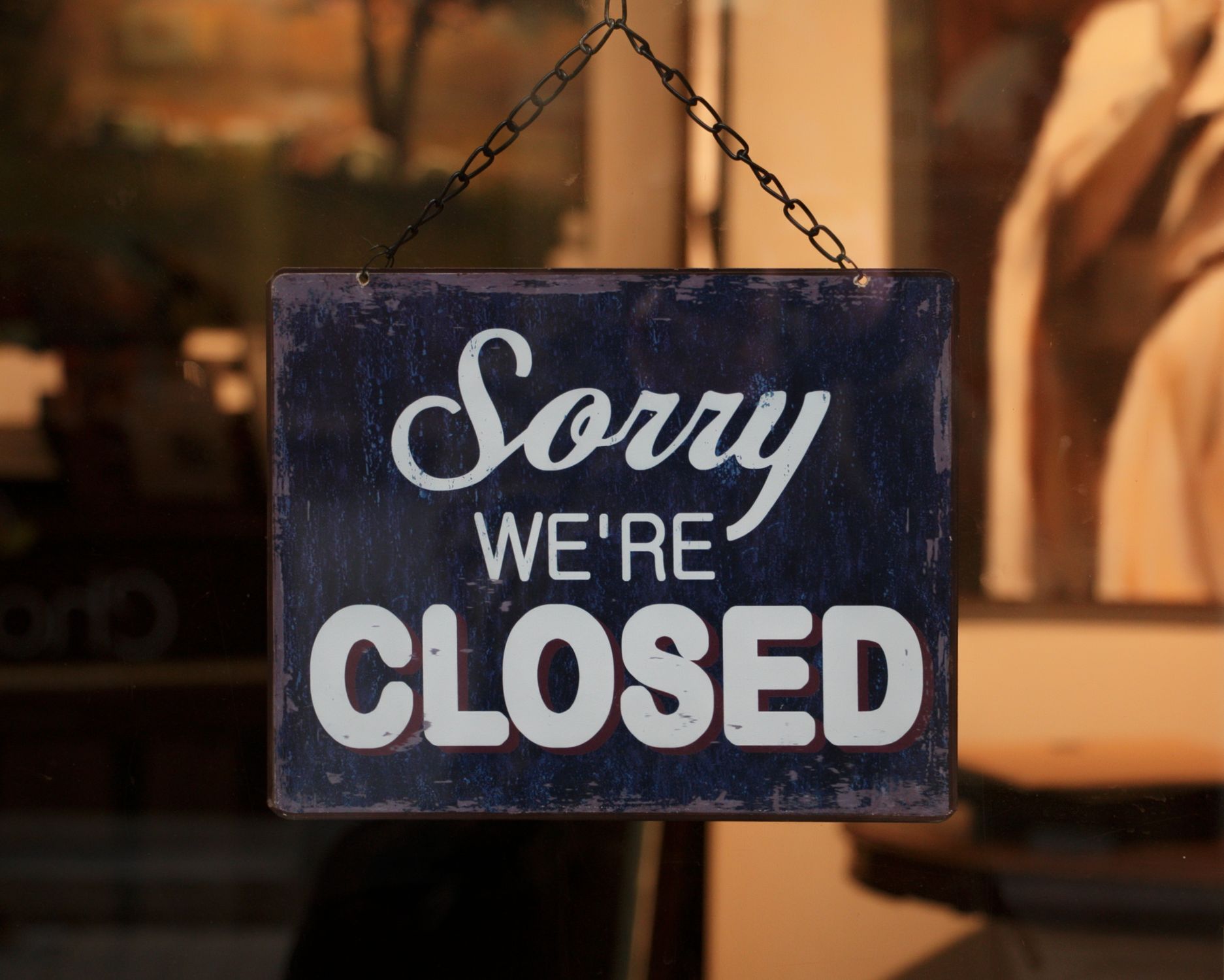 Sorry Store Sign Close-up of a Sign on the Door of a Store Saying