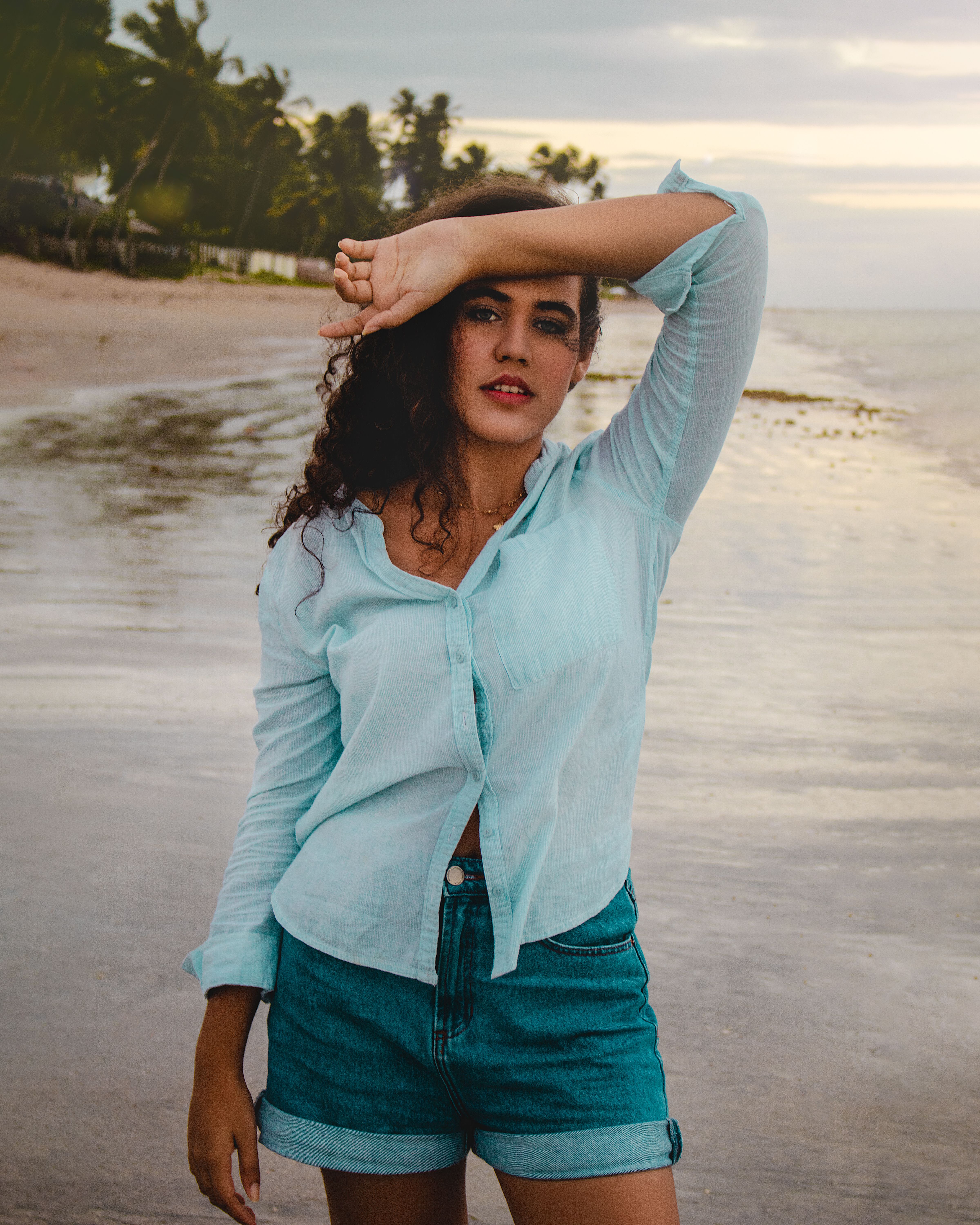 Portrait of a Woman Standing on a Beach · Free Stock Photo
