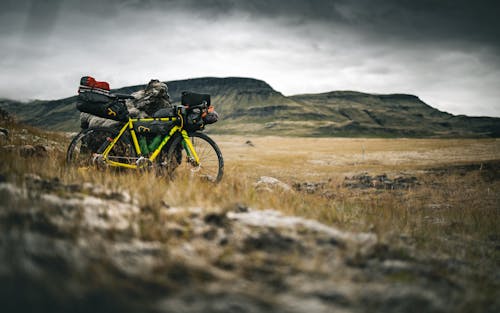 Black and Yellow Mountain Bike on Brown Grass Field