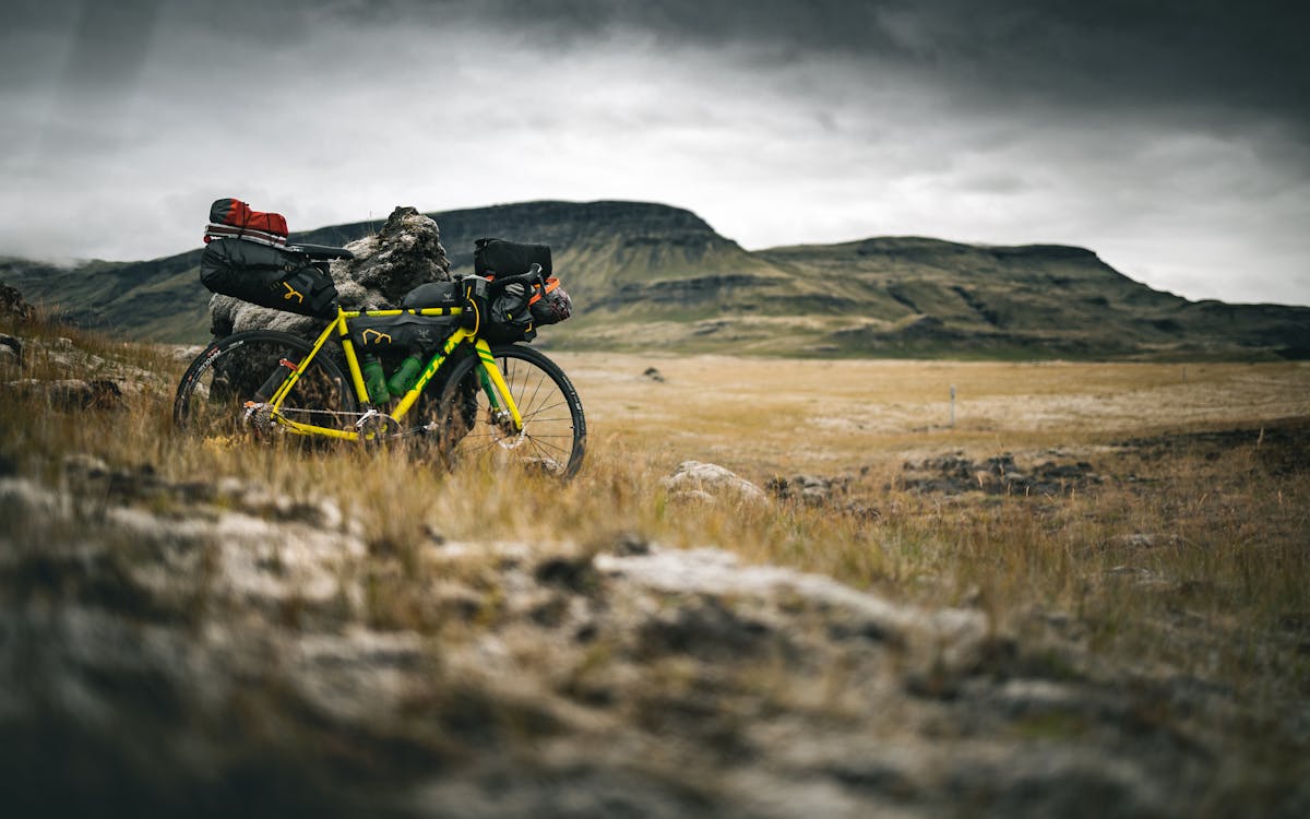 Black and Yellow Mountain Bike on Brown Grass Field
