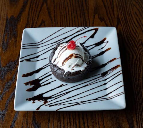 A Lava Cake with Ice Cream and Cherry on Top