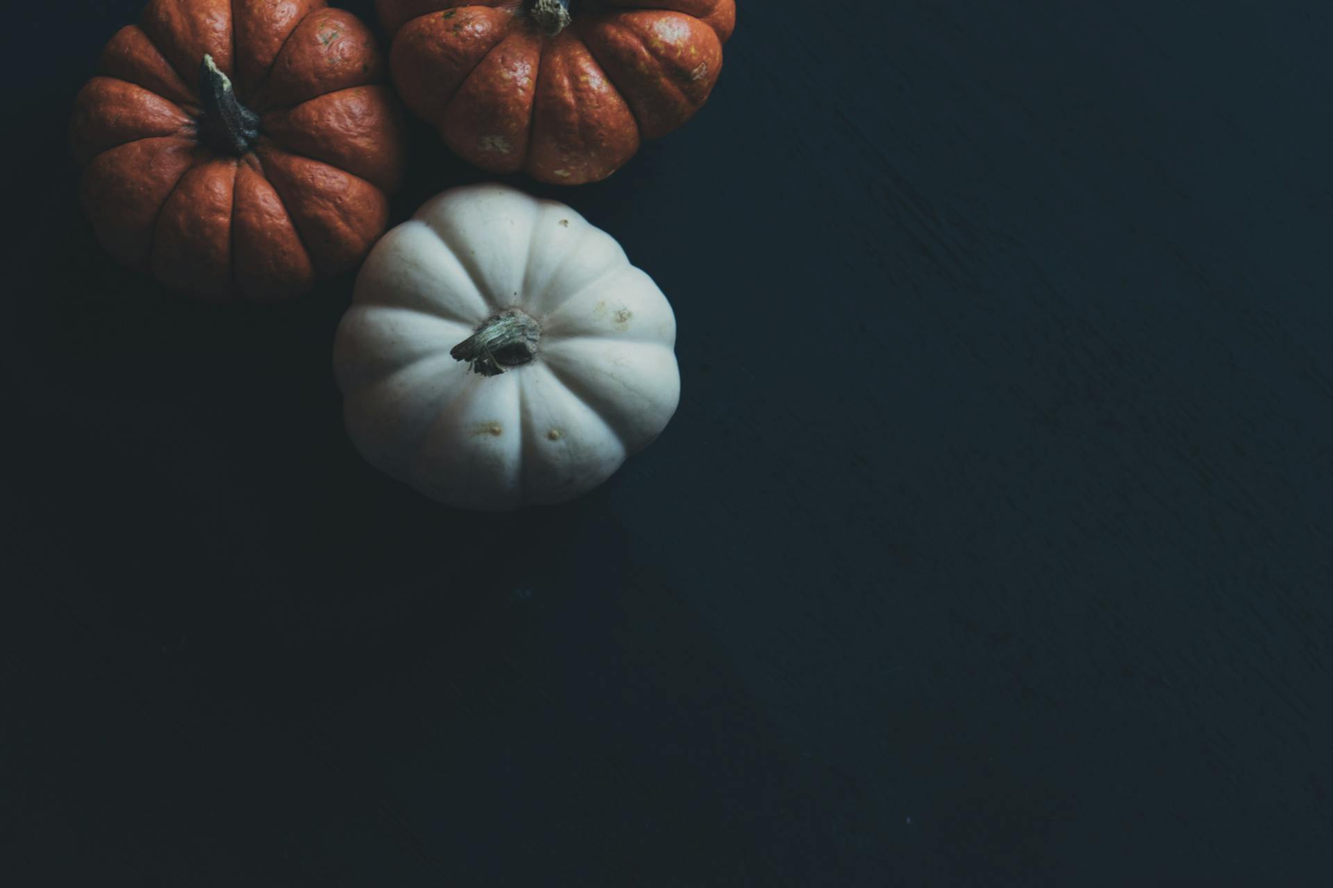 Three Orange and White Pumpkins