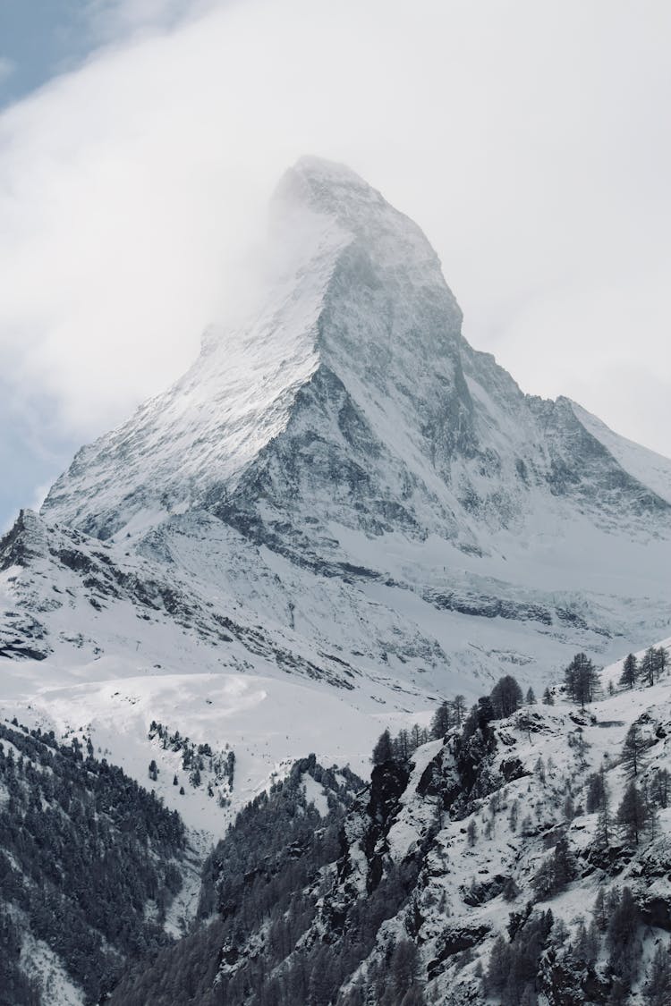 Matterhorn Peak In Alps Wrapped With Cloud In Winter Scenery