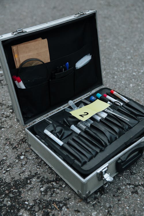 Close-up of a Suitcase with Tools for Collecting Evidence from a Crime Scene