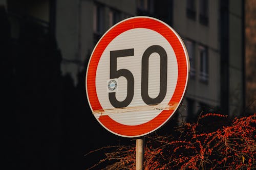 Red and White Speed Limit Road Sign