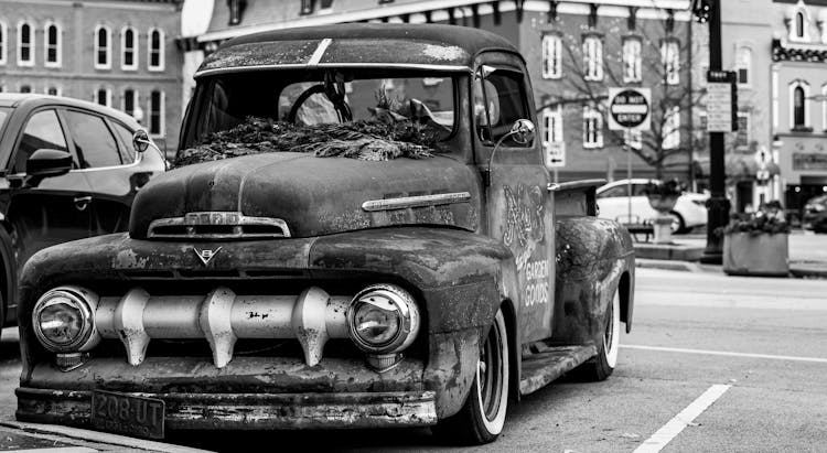 Abandoned Vintage Truck On City Parking