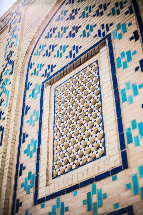 Free Explore the exquisite ceramic tilework on a historic building facade in Gijduvon, Uzbekistan. Stock Photo