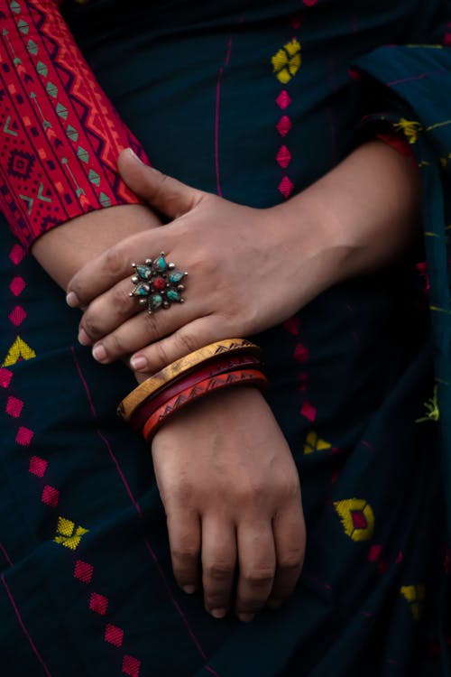 Free A Close-Up Shot of a Woman Wearing Bangles and a Ring Stock Photo