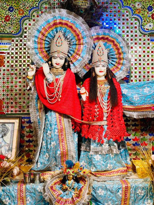 Free Beautifully adorned Hindu statues showcasing traditional attire and vibrant colors in a temple setting. Stock Photo