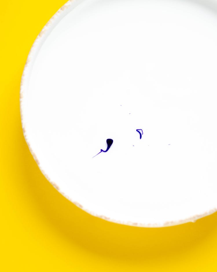 White Circle On Yellow Background