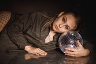 Girl in Black Leather Jacket Holding a Ball