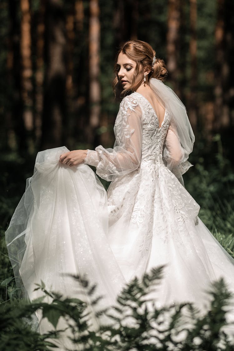 Bride In Wedding Dress In Nature