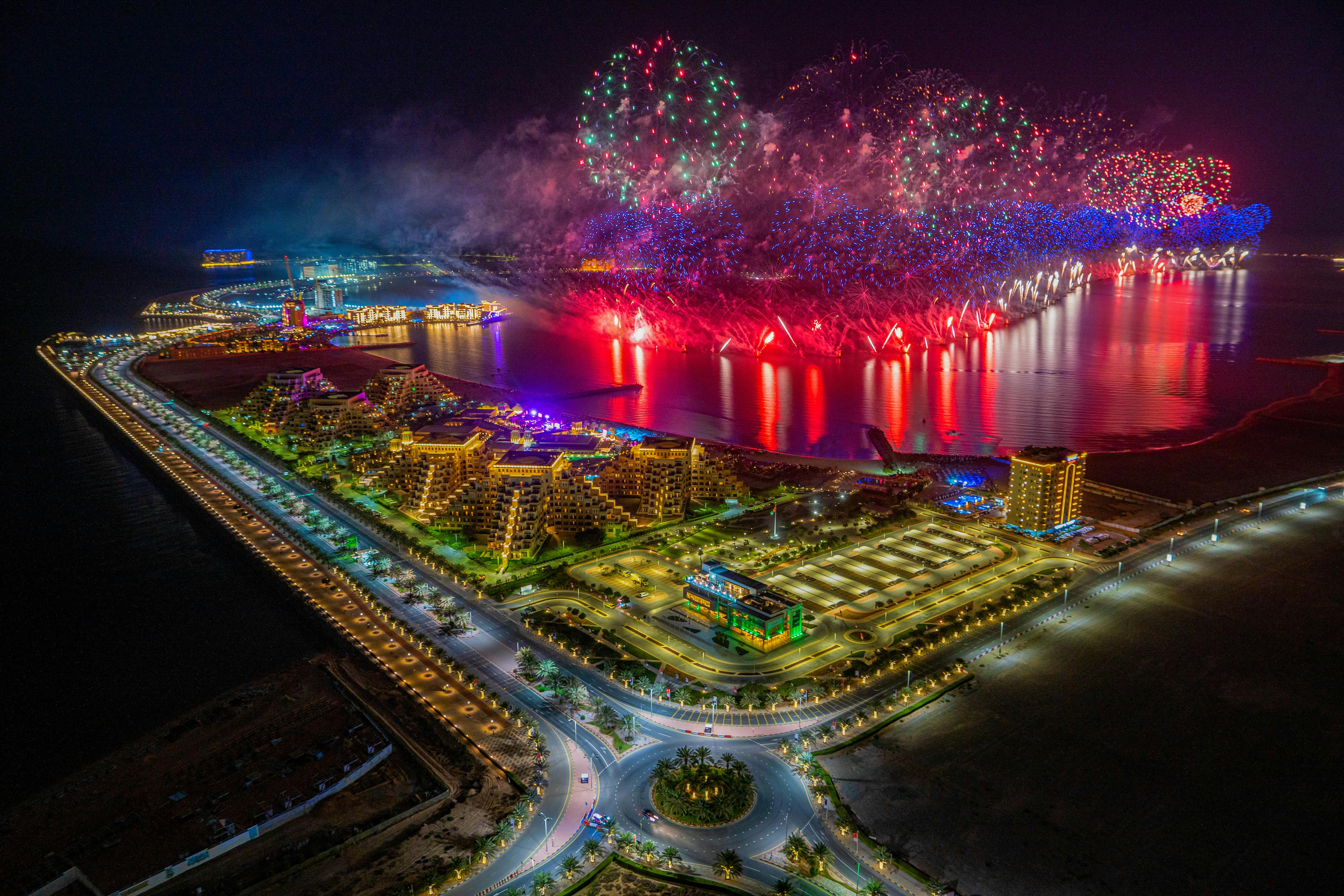 Vibrant New Year's Eve fireworks over Ras al Khaimah's Al Marjan Island.