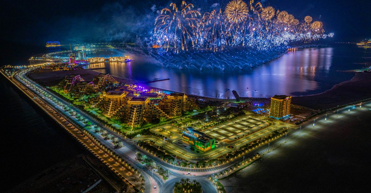 A panoramic view of luxury beachfront resorts and turquoise waters along the Ras Al Khaimah coastline.