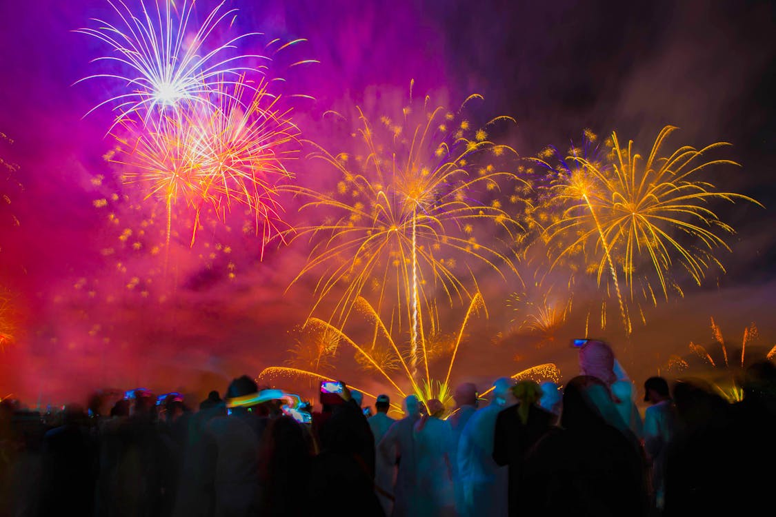 People Watching Fireworks Display during Nighttime