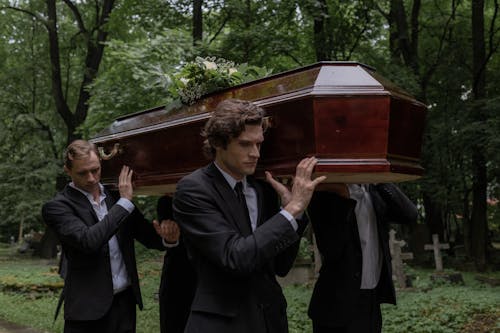 Free People Carrying Coffin Stock Photo
