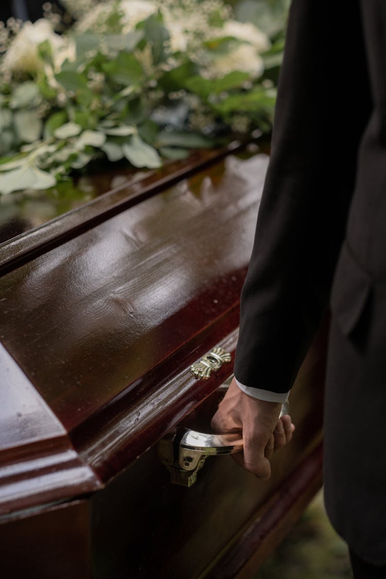 A Person Carrying A Casket 