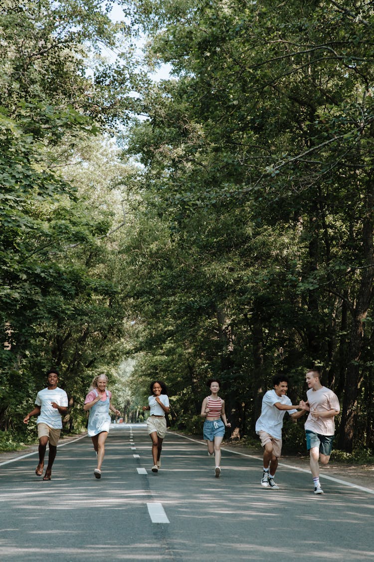 Teenagers Running On Road