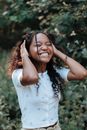 Teenage Girl Holding Hands on Head and Laughing