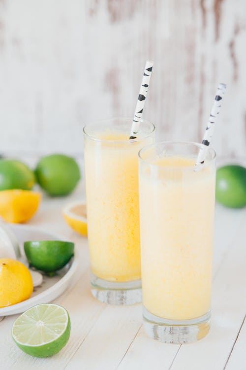 Free Clear Glass Cups With Yellow Smoothie Stock Photo