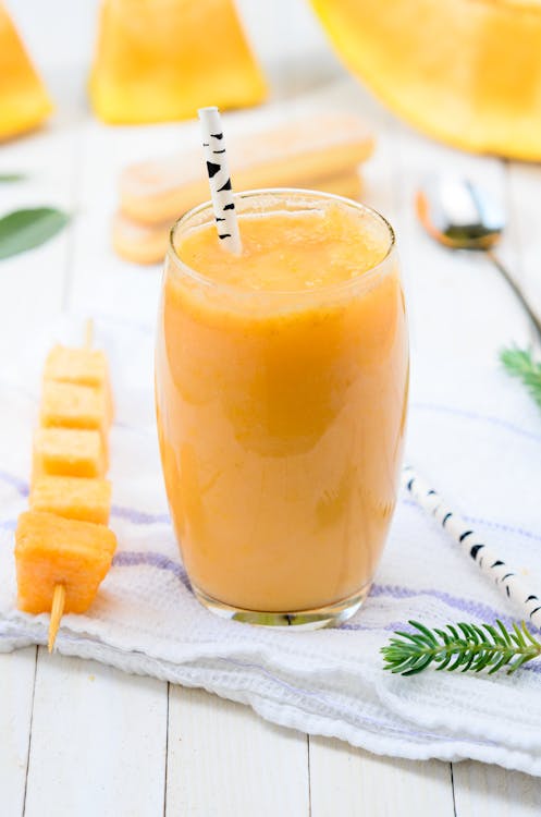 Free Clear Drinking Glass With Yellow Smoothie  Stock Photo