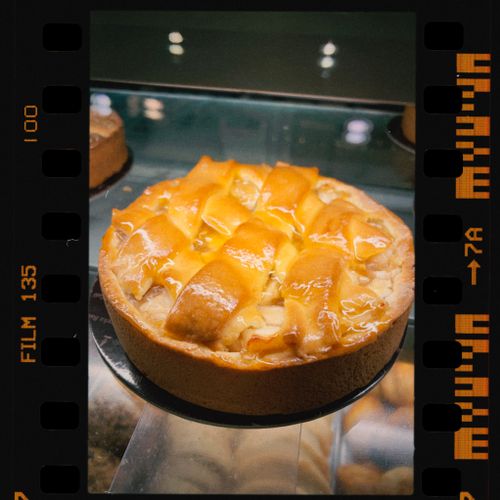 Free Close-up of a glossy apple pie with lattice crust, shot on film. Stock Photo