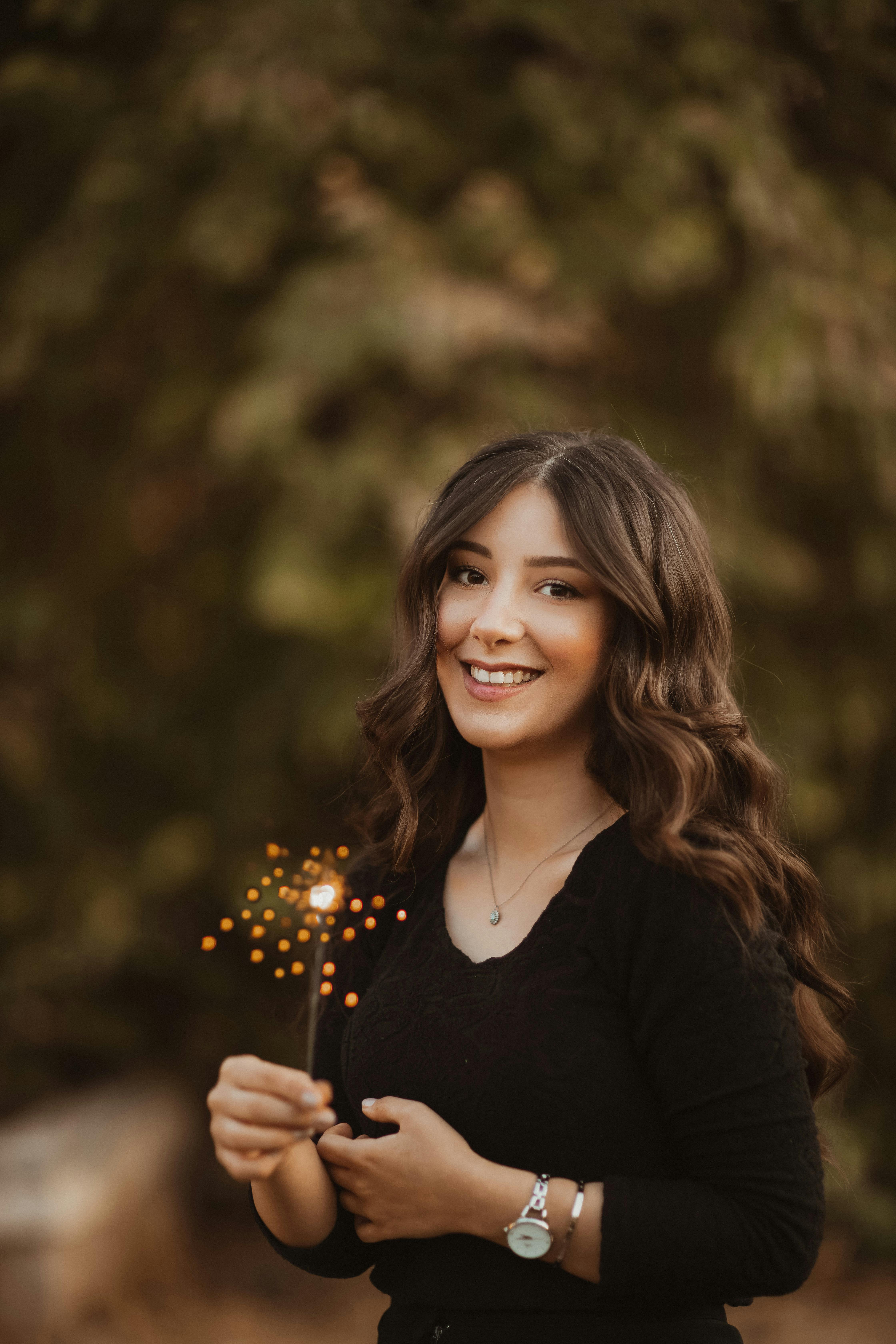 Adolescent Pretty Girl with Long Wavy Hair Holding Sparkler · Free Stock  Photo